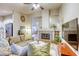 Inviting living room featuring a cozy fireplace and comfortable seating arrangement at 422 Tanita Ct, Las Vegas, NV 89123