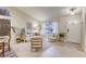 Comfortable living room showcasing large windows, a front door, and calming interior design at 422 Tanita Ct, Las Vegas, NV 89123