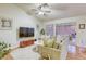 Comfortable living room with a large sofa and access to the outdoor area through sliding glass doors at 422 Tanita Ct, Las Vegas, NV 89123