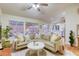 Spacious living room with a view of the kitchen, backyard, and comfortable seating area at 422 Tanita Ct, Las Vegas, NV 89123