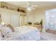 Relaxing main bedroom with natural light, a neutral color scheme, and an attached bathroom at 422 Tanita Ct, Las Vegas, NV 89123