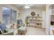 Serene sitting area featuring comfortable seating, natural light, and stylish shelving for display at 422 Tanita Ct, Las Vegas, NV 89123