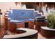 Built in barbecue with blue tile accents and seating at 4745 Gunlock Cir, North Las Vegas, NV 89031