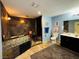 Bathroom featuring stylish vanity, stone-tiled walls and shower, with spa-like features at 4745 Gunlock Cir, North Las Vegas, NV 89031