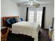Bright bedroom with large windows, ceiling fan, and comfortable bed at 4745 Gunlock Cir, North Las Vegas, NV 89031