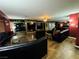 Expansive living room providing plenty of seating with comfortable furniture, ceiling fan, and flooring at 4745 Gunlock Cir, North Las Vegas, NV 89031