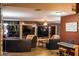 Open-concept living room featuring custom stone wall accents, modern lighting and wood-look floors at 4745 Gunlock Cir, North Las Vegas, NV 89031