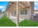 A covered back patio opens to an artificial grass lawn at 5000 Forest Oaks Dr, Las Vegas, NV 89149