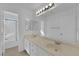 Bright bathroom featuring double sinks, large mirrors, and a shower/tub combo at 5000 Forest Oaks Dr, Las Vegas, NV 89149