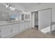 Bright bathroom features dual sinks, vanity, shower, and closet at 5000 Forest Oaks Dr, Las Vegas, NV 89149