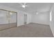 Spacious bedroom features plush carpeting and mirrored closet at 5000 Forest Oaks Dr, Las Vegas, NV 89149