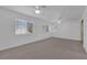 Spacious bedroom features plush carpeting and bright windows at 5000 Forest Oaks Dr, Las Vegas, NV 89149