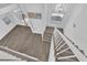Bright foyer with hardwood floors, modern lighting, and staircase at 5000 Forest Oaks Dr, Las Vegas, NV 89149