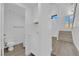 Bright hallway bathroom with white vanity and hardwood floors at 5000 Forest Oaks Dr, Las Vegas, NV 89149