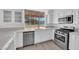 Bright and airy kitchen with stainless appliances and a view of the community at 5000 Forest Oaks Dr, Las Vegas, NV 89149