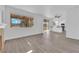 Open living space with fireplace, updated flooring, and backyard views at 5000 Forest Oaks Dr, Las Vegas, NV 89149