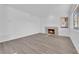 Spacious living room with hardwood floors and cozy fireplace at 5000 Forest Oaks Dr, Las Vegas, NV 89149
