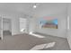 Bright main bedroom with plush carpet, ceiling fan and large windows at 5000 Forest Oaks Dr, Las Vegas, NV 89149