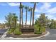 The entrance to the Portraits community is landscaped and features a sign at 5000 Forest Oaks Dr, Las Vegas, NV 89149