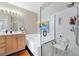 Bathroom featuring a separate glass shower, tub, vanity, and modern fixtures at 5218 Blue Gum Ct, Las Vegas, NV 89148