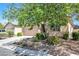 Charming home with well-manicured landscaping and a driveway at 5218 Blue Gum Ct, Las Vegas, NV 89148