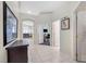 Bright hallway with tile flooring, arched doorways, and views of adjacent rooms at 5218 Blue Gum Ct, Las Vegas, NV 89148