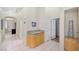 Hallway view featuring tile flooring, cabinetry, and neutral wall-paint at 5218 Blue Gum Ct, Las Vegas, NV 89148