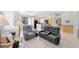 Spacious living room with tile flooring, comfortable seating, and an open layout at 5218 Blue Gum Ct, Las Vegas, NV 89148