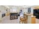 Open living area with a fireplace, lots of natural light, and tile flooring at 5218 Blue Gum Ct, Las Vegas, NV 89148