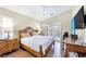 Spacious main bedroom with a ceiling fan, wood-look floors, and closet at 5218 Blue Gum Ct, Las Vegas, NV 89148
