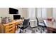 Office space offering dual desks and natural light from shuttered windows at 5218 Blue Gum Ct, Las Vegas, NV 89148