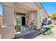 Cozy covered patio with outdoor seating and views of the backyard at 5218 Blue Gum Ct, Las Vegas, NV 89148