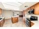 Well-lit kitchen with modern appliances and center island, open to living area with pool view at 5248 W Lake Mead Blvd, Las Vegas, NV 89108