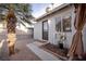 Private backyard patio with a tropical palm tree and potential for outdoor living at 5408 Longridge Ave, Las Vegas, NV 89146