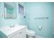 Bathroom featuring a white vanity, toilet, and open shelving for storage at 5408 Longridge Ave, Las Vegas, NV 89146