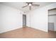 Bedroom featuring neutral-toned tile floors, a ceiling fan, and a closet at 5408 Longridge Ave, Las Vegas, NV 89146