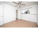 Bedroom featuring neutral-toned tile floors, a ceiling fan, and a closet at 5408 Longridge Ave, Las Vegas, NV 89146