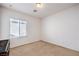 Bedroom with carpeted floors and a window offering natural light at 5525 Criollo Dr, Las Vegas, NV 89122