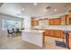Bright kitchen featuring tile floors, large island and light wood cabinetry at 5525 Criollo Dr, Las Vegas, NV 89122