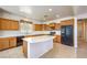 Spacious kitchen boasts light wood cabinetry, white countertops, and black appliances at 5525 Criollo Dr, Las Vegas, NV 89122
