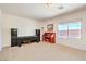 Bright living room featuring neutral carpet and large window with views of the outside at 5525 Criollo Dr, Las Vegas, NV 89122