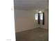 Carpeted bedroom with two windows with black curtains, and ceiling fan at 5642 Sunset Amber Ave, Las Vegas, NV 89122