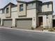 Modern two-story townhome featuring a two-car garage and stylish architectural details at 5642 Sunset Amber Ave, Las Vegas, NV 89122