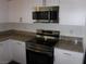 Modern kitchen featuring stainless steel appliances and granite countertops at 5642 Sunset Amber Ave, Las Vegas, NV 89122