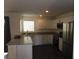 Bright kitchen featuring stainless steel appliances, granite countertops, and white cabinetry at 5642 Sunset Amber Ave, Las Vegas, NV 89122