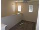 Cozy loft area with carpet flooring, three windows, and a ceiling fan at 5642 Sunset Amber Ave, Las Vegas, NV 89122