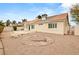 Backyard featuring desert landscaping, patio, and mature trees that provide a relaxing outdoor oasis at 6209 Lenaking Ave, Las Vegas, NV 89122
