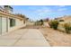 View of spacious backyard patio and desert landscaping providing a private outdoor living space at 6209 Lenaking Ave, Las Vegas, NV 89122