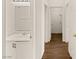 Hallway bathroom with a single sink vanity conveniently located near additional rooms and storage at 6209 Lenaking Ave, Las Vegas, NV 89122
