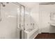 Well-lit bathroom featuring a separate glass shower and soaking tub at 6209 Lenaking Ave, Las Vegas, NV 89122